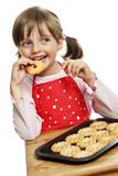 little girl eating cookies