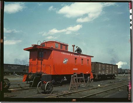 Putting the finishing touches on a rebuilt caboose at the rip tracks at Proviso yard. Chicago, Illinois, April 1943. Reproduction from color slide. Photo by Jack Delano. Prints and Photographs Division, Library of Congress