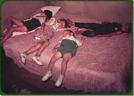 Children asleep on bed during square dance. McIntosh County, Oklahoma, 1939 or 1940. Reproduction from color slide. Photo by Russell Lee. Prints and Photographs Division, Library of Congress