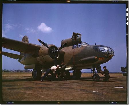 Servicing an A-20 bomber. Langley Field, Virginia, July 1942. Reproduction from color slide. Photo by Alfred T. Palmer. Prints and Photographs Division, Library of Congress