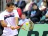 Croatia's Ivan Dodic returns the ball against Italia's Andreas Seppi during the Davis Cup 1st round World Group in Turin, Italy, Friday, Feb 1, 2012. (Ap Photo/Massimo Pinca)