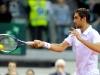 Croatia's Team players Marin Cilic in action during doble match against Italia's Team players Fabio Fognini and Simone Bolelli during the Davis Cup 1st round World Group in Turin, Italy, Saturday, Feb 2, 2012. (Ap Photo/Massimo Pinca)