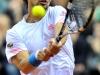 Italia's Team players Fabio Fognini in action during doble match against Croazia's Team players Marin Cilic and Ivan Dodig during the Davis Cup 1st round World Group in Turin, Italy, Saturday, Feb 2, 2012. (Ap Photo/Massimo Pinca)