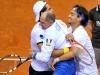 Italia's Team players Fabio Fognini,right, and Simone Bolelli,left, celebrates with Italia's Team Captain Corrado Barazzutti at end doble match against Croatia's Team players Ivan Dodig and Marin Cilic during the Davis Cup 1st round World Group in Turin, Italy, Saturday, Feb 2, 2012. (Ap Photo/Massimo Pinca)