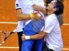 Italia's Team players Fabio Fognini,right, and Simone Bolelli,left, celebrates with Italia's captain Corrado Barazzutti at end doble match against Croatia's Team players Ivan Dodig and Marin Cilic during the Davis Cup 1st round World Group in Turin, Italy, Saturday, Feb 2, 2012. (Ap Photo/Massimo Pinca)