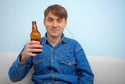 14830801-man-relaxing-with-a-bottle-of-beer-at-home