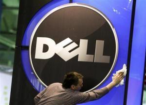 A man wipes logo of Dell IT firm at CeBIT exhibition centre in Hannover