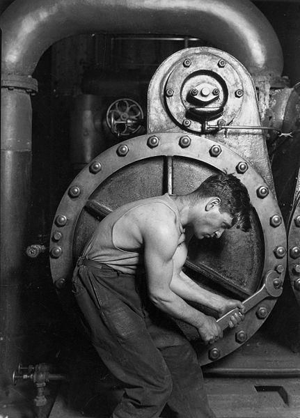 431px-Lewis_Hine_Power_house_mechanic_working_on_steam_pump