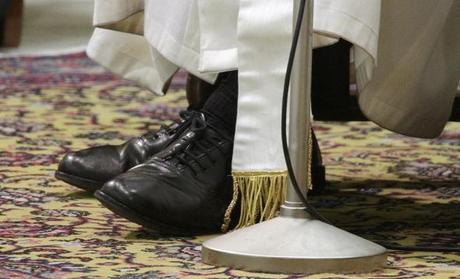 The shoes of Pope Francis I are seen as he conducts a general audience in the Paul VI hall for members of the media at the Vatican