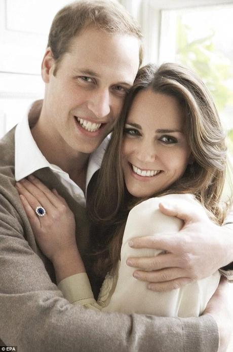 Hands-on prince: Shunning the traditional Royal reserve, Prince William proudly holds Kate in a protective, loving and close embrace - to her obvious delight