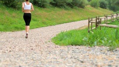 stock-footage-attractive-woman-jogging-in-the-park-dolly-shot-shot-at-fps