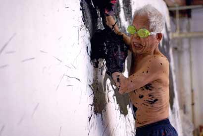Ushio Shinohara working on a boxing painting. From Zachary Heinzerling’s CUTIE AND THE BOXER, a documentary about the 40-year marriage of artists Ushio and Noriko Shinohara. Photo credit: Patrick Burns