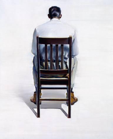 Man-Sitting-Back-View