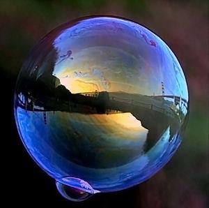 Golden Gate Bridge is reflected in a soap bubble