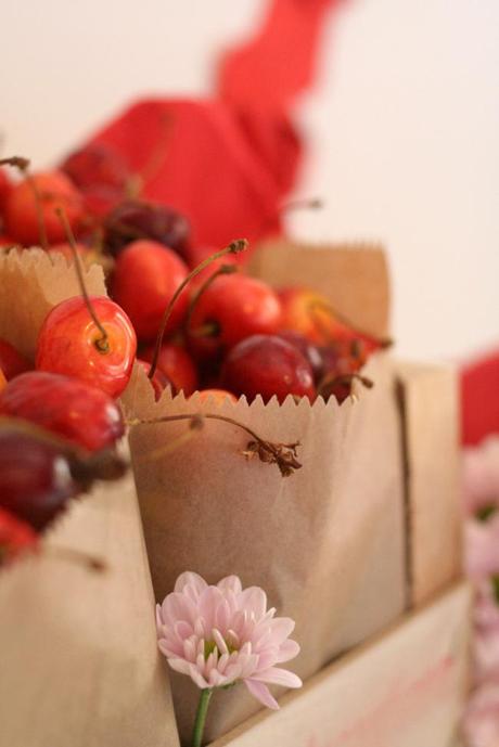 bags of cherries into a fruit box