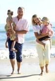 18720048-grandparents-and-grandchildren-enjoying-beach-holiday