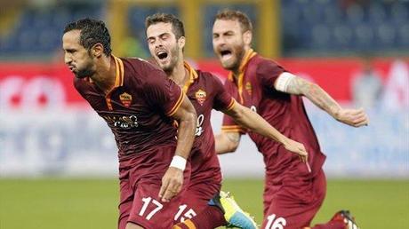 AS Roma Medhi Benatia (L) celebrates with his teammates Alessandro Florenzi (C) and Daniele De Rossi