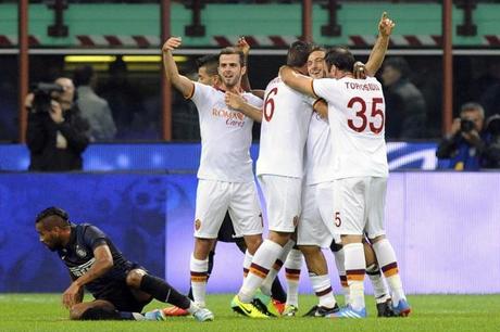 AS Roma's Totti celebrates with his team mates after scoring against Inter Milan during their Italian Serie A soccer match at the San Siro stadium in Milan