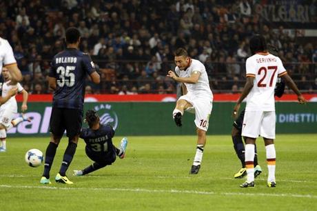 AS Roma's Totti shoots to score against Inter Milan during their Italian Serie A soccer match at the San Siro stadium in Milan