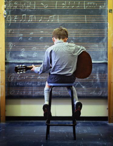 Boy Practicing Guitar