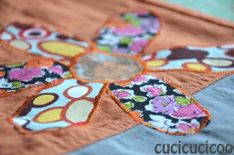 flower applique on ripped pants