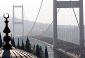 Participants run over the Bosphorus Bridge that links the city's European and Asian sides during the annual Eurasia Marathon in Istanbul