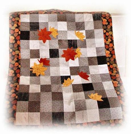 Cambio di stagione: piumotto patchwork con appliqué