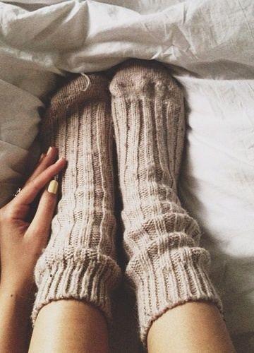 cozy socks make us want to snuggle in bed all day