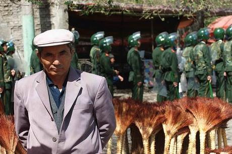 Uygurs Peddler and Armed police,Hanren street,Yining City,Xinjiang,2009