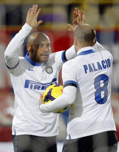 Inter Milan's Jonathan celebrates with his team mate Palacio after scoring against Bologna during their Italian Serie A soccer match in Bologna