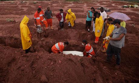 Mourners at the burial of a landslide victim in Teresópolis, Brazil