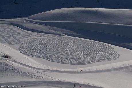 Doubling up: Mr Beck uses what he describes as a 'kind of reverse orienteering' to plot his intricate paths before walking along the route in a pair of snowshoes