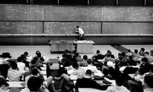 A physics lecture and blackboard