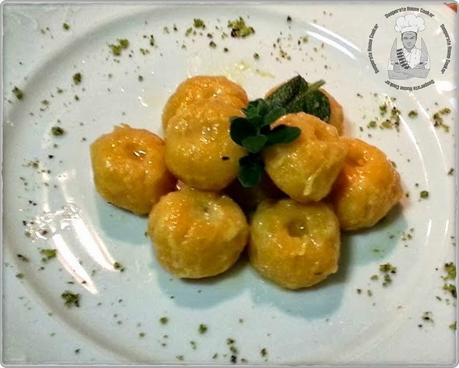 Gnocchi di zucca ripieni di fonduta al pistacchio, succo di zenzero e amaretti