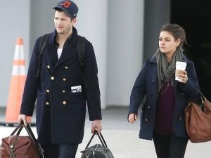 Ashton Kutcher con Mila Kunis e le valigie