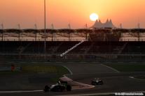 Track action while the sun is setting over the Bahrain International Circuit