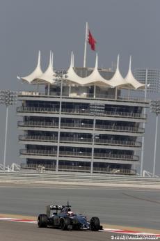 View of the Tower at the Bahrain International Circuit with Kevin Magnussen (McLaren) driving on track