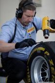 A Pirelli technician is checking the degradation level of a P Zero Yellow soft tyre Report Pirelli: F1 Test 2014 Bahrain 2