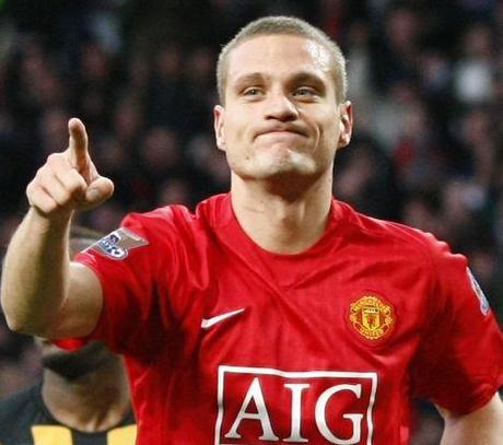 Manchester United's Vidic celebrates after scoring during their English Premier League soccer match against Hull City in Manchester