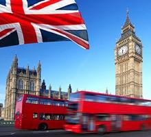 Big Ben with city bus and flag of England, London