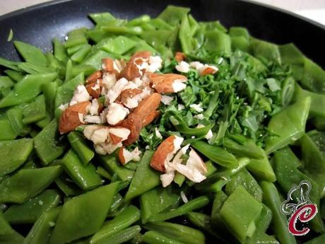 Polpettine alla rucola su fagioli piattoni e mandorle: concorrenze tra ricordi e nuove identità