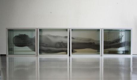Giancarlo Marcali, Uomo morente, 2013, installazione - scatole specchio, radiografie, immagini, cm 180x37x12