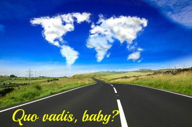 Clouds in the shape of the world over an open country road.