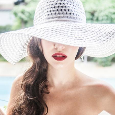 aaa woman-on-holiday-beach-red-lipstick-floppy-sun-hat-cocktail-summer-style-nautical-navy-swimsuit_1