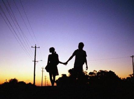 happy-teen-couple-holding-hands