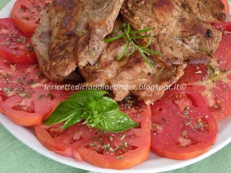 Braciole di maiale con pomodori