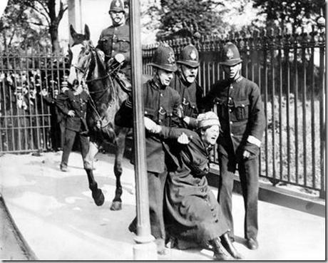 A woman campaigning for the vote is restrained by policemen. British women did not win full voting rights until 1928.
A woman campaigning for the vote is restrained by policemen. British women did not win full voting rights until 1928.