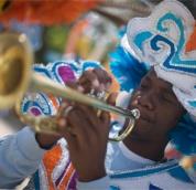 Man playing a trumpet for the Junkanoo festivities in The Bahamas