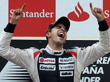 Williams Formula One driver Pastor Maldonado of Venezuela celebrates on the podium after his victory in the Spanish F1 Grand Prix in Montmelo