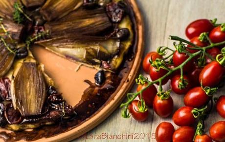 tarte tatin with confit tomatoes and red onions